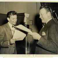 Sinatra photo: Frank Sinatra & Fred Allen in radio studio rehearsing at microphone with scripts, n.p. (N.Y.), November 26, 1946.