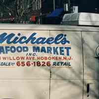 Color photo of a delivery truck sign for Michael