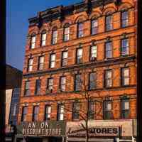 Color slide of eye-level view of façades of 318 & 320 Washington between 3rd & 4th occupied by the Ancona Discount Stores