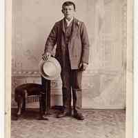 Cabinet photo of young man posed in photographer