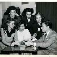 Sinatra photo: Frank Sinatra discussing Youth Rally with 5 young women, New York, ca. Oct 23, 1944.