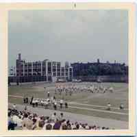 Color photo of a marching band, J.F.K. Stadium, 10th & Jefferson Sts., Hoboken, n.d., ca. 1965-1975.