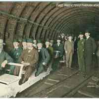 Digital image of Hudson & Manhattan R.R. postcard titled: First party to go through the McAdoo Tunnel, N.Y. no date, ca. 1908.