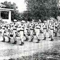 Digital image of photocopy of published b+w photo of Our Lady of Grace Lancers marching, location, no place, 1959.