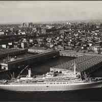 B+W aerial photo of S.S. Rotterdam arriving on its maiden voyage at 5th St. Pier, Holland America Line, Sept.11, 1959.