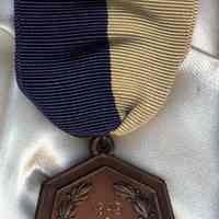 Digital images of four medals received by Paula Millenthal from Stevens Hoboken Academy, Hoboken, 1955.