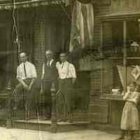          detail right, men, children, barber shop window
   