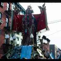 Color slide of Madonna statue being carried down a street.