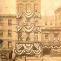 Sepia-tone photo of decoration by United Decorating on 112 Hudson St. Hoboken, n.d., ca. 1900-1910.