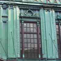          11: windows above entrance canopy to main waiting room, north facade
   