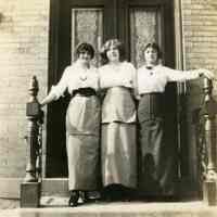 Sepia-tone photos, 2, of Rose Beck, friends & nieces at 600 Madison St. entrance, Hoboken, Spring 1914.