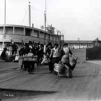 B+W photo of immigrants arriving at Ellis Island, New York, n.d, ca. 1910. of immigrants arriving at Ellis Island, New York, no date, circa 1910.