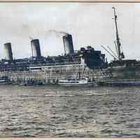 Sepia-tone photo of U.S.S. Leviathan during war service; near port. No place, no date, ca. 1917-1919.