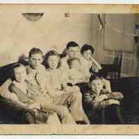 B+W group photo posed on sofa inside Smith home, 15 Willow Terrace, Hoboken, n.d., ca. late 1940s.