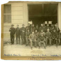          Sepia-tone group photo of Keuffel & Esser Co. employees posed outside newly opened west plant on Adams St. near 3rd St. for K&E 40th anniversary, Hoboken, July 20, 1907. picture number 7
   