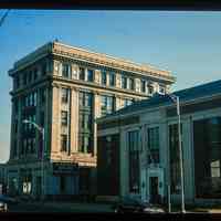          Color slide of eye-level view of the façades of the U.S. Post Office building on the right at 89 River and the Steneck Building/Seaboard Building on the left at 95 River occupied by the Garden State National Bank between Newark and 1st picture number 1
   