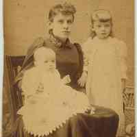 Digital image of sepia-tone photo portrait of Mary Jacobsen, wife of painter Antonio Jacobsen, with children Carl and Helen, J.C., no date, ca. 1880.