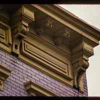 Color slide of detail view of cornice, brackets, frieze and window heads at 457 2nd between Adams and Jefferson