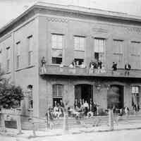 B+W photo of the Deutscher Club (German Club) at the northwest corner of 6th & Hudson Sts., ca. 1860