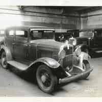 B+W photos, 2, of passenger automobile inside Model Garage?, 208-214 Clinton St.?, Hoboken, Dec. 5, 1931.