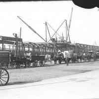 B+W photo of Public Service Railway Terminal in background; Teams in line to board D.L.& W. ferry, Hoboken, March 23, 1905.