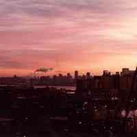 Digital scan of color photo of a sunrise view of Hoboken & Bethlehem Steel Hoboken Shipyard, Hoboken, no date, circa 1970-1980.
