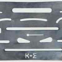 Erasing shield, stamped metal with K&E logo. Made by Keuffel & Esser Co., n.d., ca. 1950-1960.