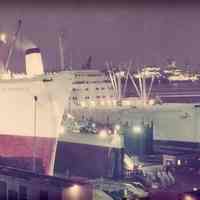 Color photo of S.S. Constitution & S.S. Independence in drydock, Hoboken Shipyard, ca. 1964.