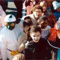 Color photo of the 1985 Hoboken Ragamuffin Parade with parents and children in costume, Hoboken, October, 1985.