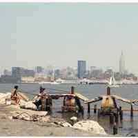 Color photo of old pier deck and pilings, Hudson River near 6th to 8th Sts., Hoboken, July 1984.