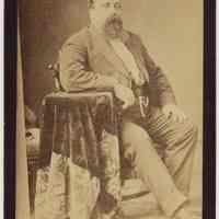 Cabinet photo of a heavy man posed in photographer