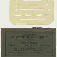 Erasing shield N3412; frosted plastic with K&E logo. Made by Keuffel & Esser Co., n.d., ca. 1939-1944.