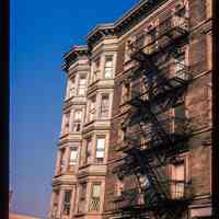          Color slide of detail view of row house façades, cornices and fire escape on buildings at Washington and 3rd picture number 1
   