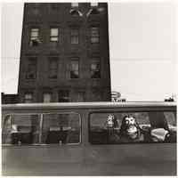 B+W photo of a van with painted Christ figures and text with the Cocomalt My-T-Fine Pudding sign in the background, Hoboken, no date, [1976].