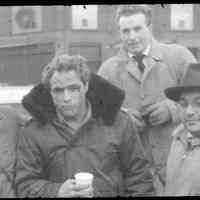 Color slide of Marlon Brando and 3 men on pier set of the motion picture "On the Waterfront", Hoboken, no date, ca. late 1953-early 1954.