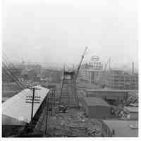 B+W photos, 32, of demolition of trolley trestle, Hoboken, 1949.