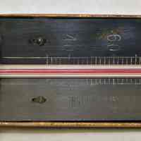          detail front: company name; scale; serial  number (left)
   
