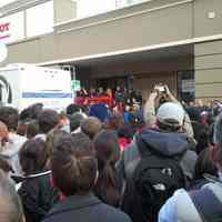 Color photo of Hoboken residents gathered near 59 Washington Street, probable news conference, Hoboken, ca. Oct. 31, 2012.