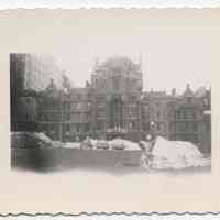 B+W photo of a winter-time view of building (school?) exterior with parking lot and automobiles, Hoboken?, no date, ca. mid-1950