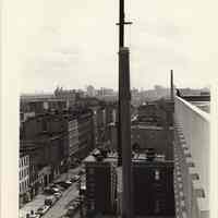 B+W photo of a vent stack being installed on the power plant of Saint Mary Hospital, Hoboken, no date, ca.1974-1975.