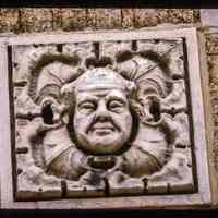 Color slide of close-up view of decorative tile at 501 Adams on the NE corner with 5th