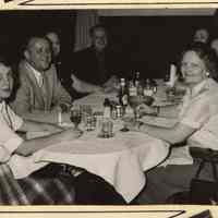          3, left column, 2nd from bottom: group at dining table
   