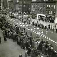 B+W photo of Hoboken Centennial Parade marching units & viewers in 200 block of Washington St., March 27, 1955.