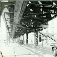 B+W copy photo of view to the west standing under the elevated streetcar railway on Ferry St. looking to the corner of Washington St., Hoboken, 1948.