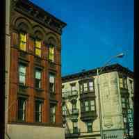 Color slide of eye-level view of 938 and 1000 Washington at the intersection of Washington & 10th looking NW showing Washington Savings Bank and Tucker