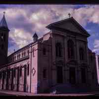 Color slide of eye-level view of front and side façades and bell tower of St. Ann