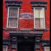 Color slide of close-up view of portico, pediments, brackets and date stone reading "WILLOW FLAT. 1884" at 942 Willow on the SW corner of Willow and 10th