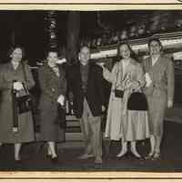          4, left column, bottom: group posed at amusement park
   