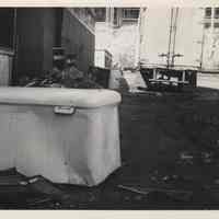 B+W photo of debris and rubbish at 11th and Madison Streets with trucks in the background, Hoboken, no date, ca. 1970-1980.