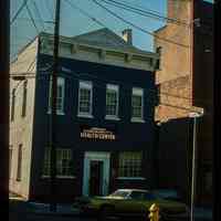 Color slide of eye-level view of the Hoboken Community Health Center building façade at 61 5th on the SW corner of 5th and Court